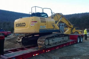 Towing earth moving machine