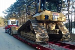 Towing earth moving machine