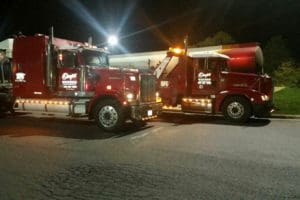 Towing trucks at night