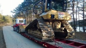 Towing earth moving machine