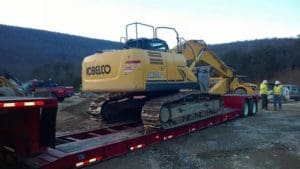 Towing earth moving machine
