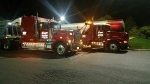 Towing trucks at night