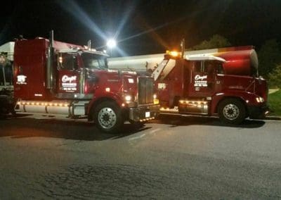 Towing trucks at night