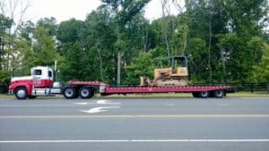 Towing earth moving machine