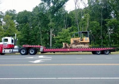 Towing earth moving machine